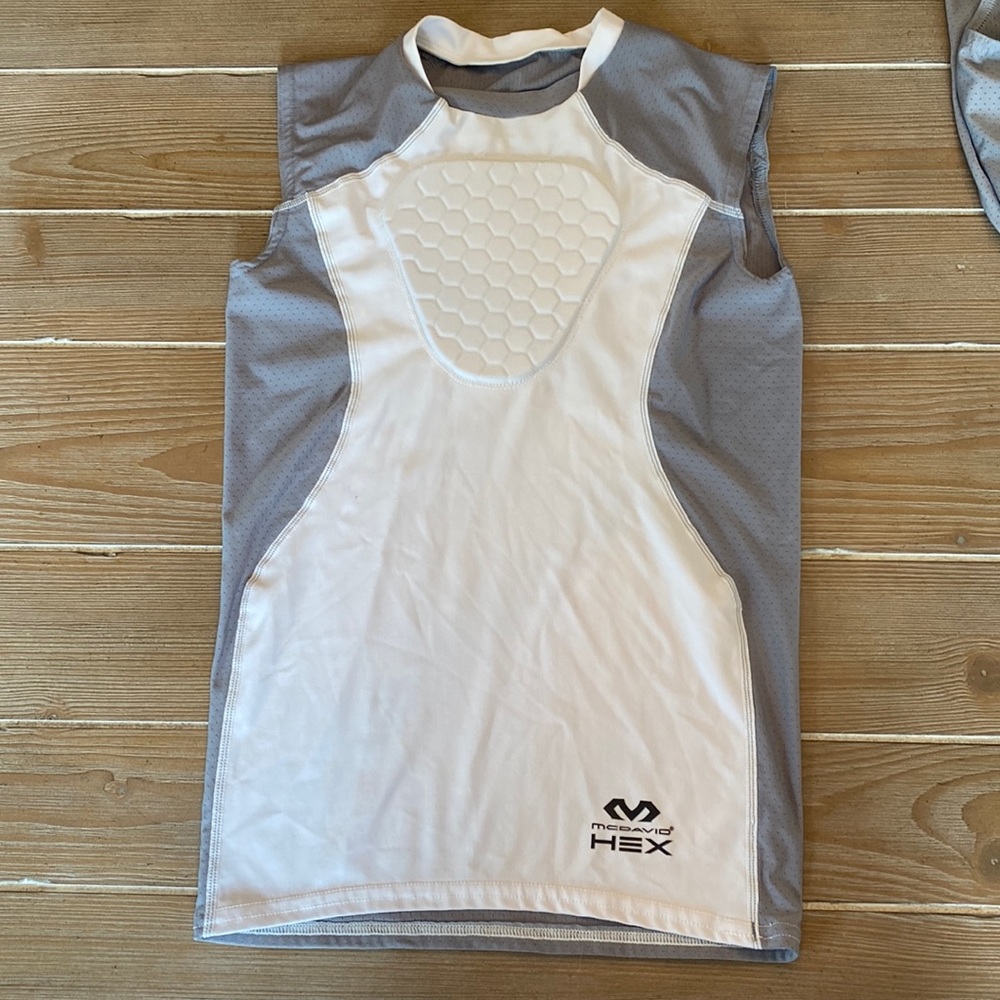 Never worn Youth M padded chest protector shirt
